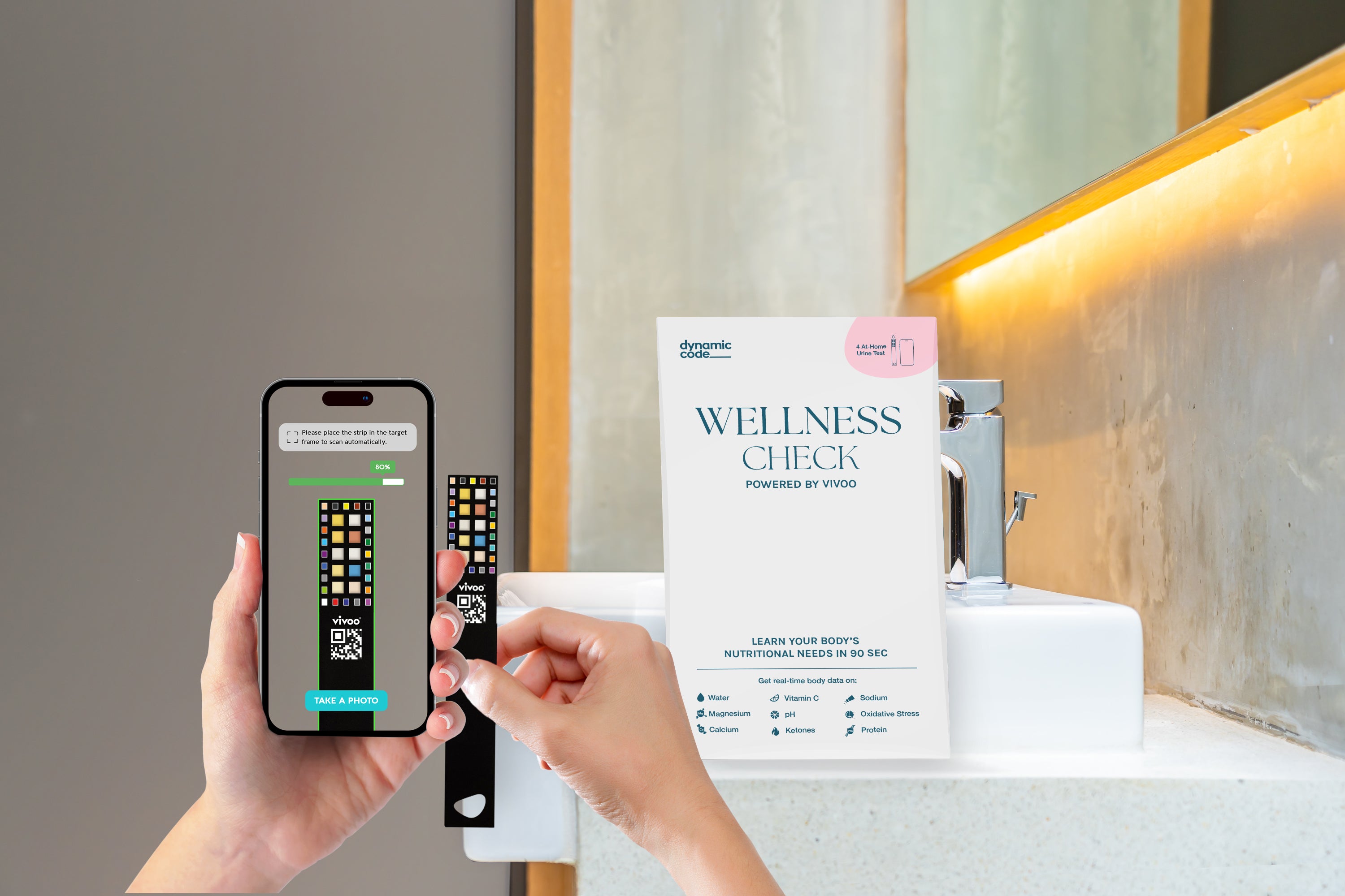 A person holding a test strip near a smartphone displaying a scanning interface for a wellness check. The test strip is being scanned for nutritional analysis. A box labeled 'Wellness Check Powered by Vivoo' is placed on a sink, emphasizing a user-friendly at-home urine test for analyzing hydration, vitamins, minerals, and other health indicators.